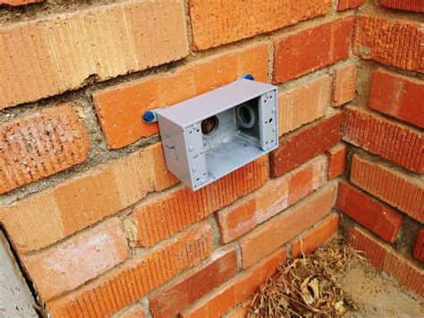 attach electrical box to brick|external outlet for brick wall.